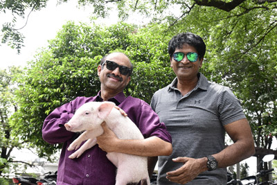 Suresh Babu and Ravi Babu Stills With Piglet